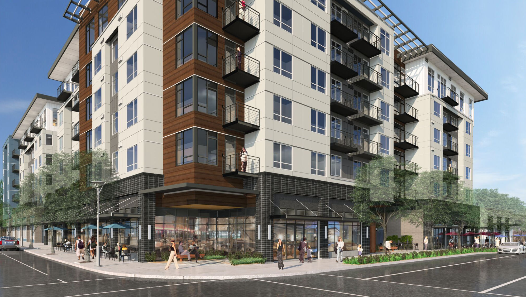 rendering of Sky Sammamish project from the street corner, showcasing street level retail with multifamily units with balconies above