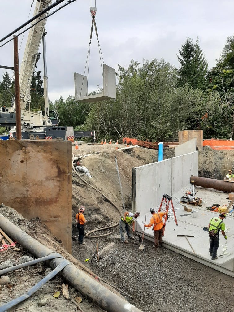 The last culvert base section being lowered into place for the Ebright Creek Fish Passage project.