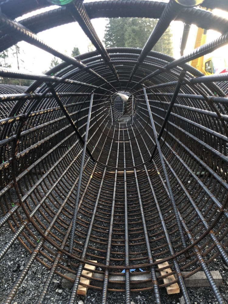 large tube made of rebar for construction of Issaquah Fall City Road
