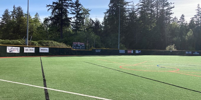 Eastlake Community Sports Field 3 in Sammamish sits empty with evergreen trees in the background.