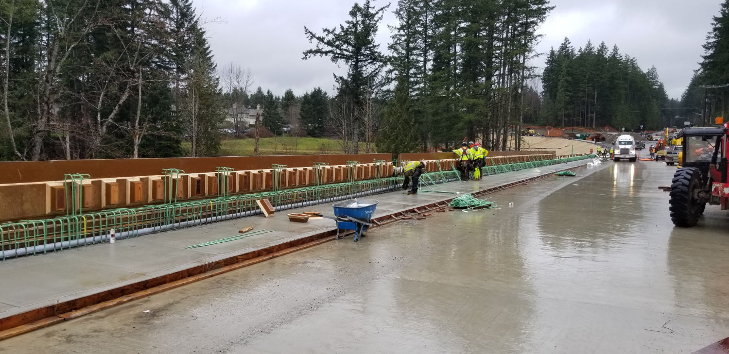 new sidewalk on bridge beside forms for railings