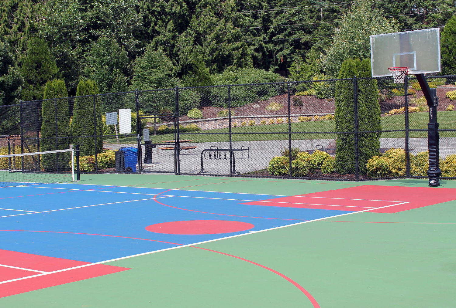 ebright creek park blended tennis / basketball court with picnic area behind