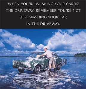 Man washing car on top of a lake with caption: when you're washing your car in the driveway, remember you're not just washing your car in the driveway.